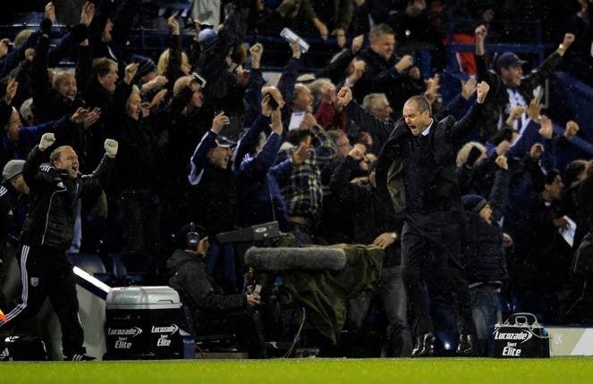 Steve Clarke celebrates a West Brom goal