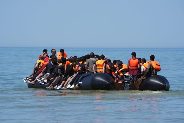 People thought to be migrants on board a small boat off the coast of Hardelot, France last month
