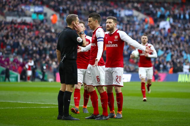 Shkodran Mustafi remonstrated with referee Craig Pawson as he felt he was fouled by Aguero before the opening goal