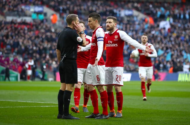 Shkodran Mustafi remonstrated with referee Craig Pawson as he felt he was fouled by Aguero before the opening goal