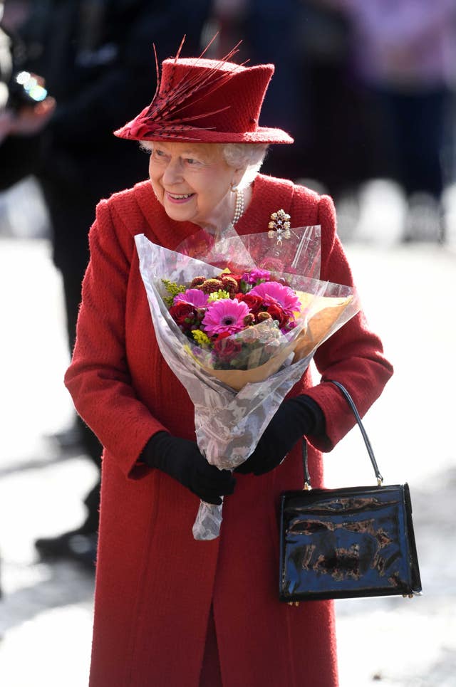 The Queen was handed flowers by members of the public (Joe Giddens/PA)