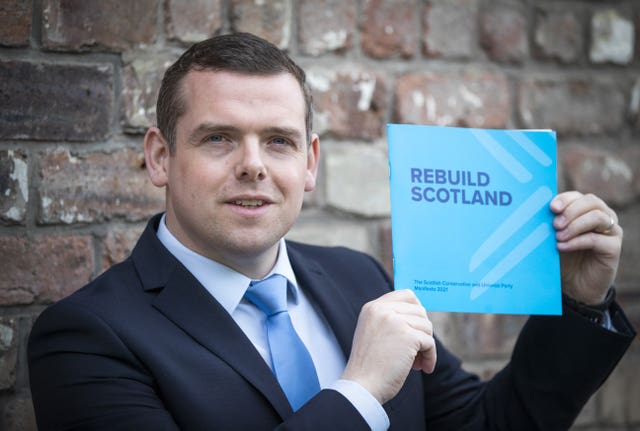 Douglas Ross holding the Tory 2021 manifesto