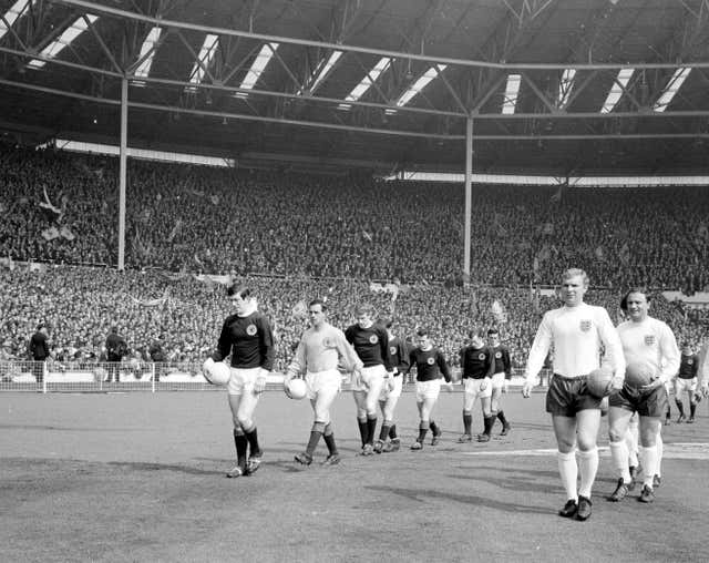 John Greig and Bobby Moore lead out the teams 