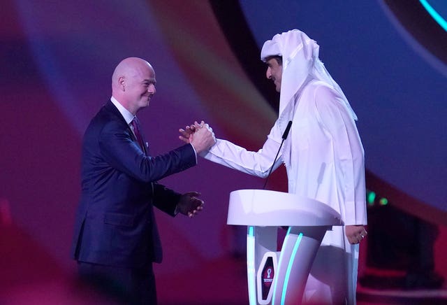 FIFA president Gianni Infantino and Qatar Emir Tamim bin Hamad Al Thani greet each other at the World Cup finals draw in Doha in April