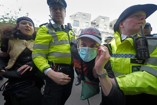 Police remove a protester amid demonstrations