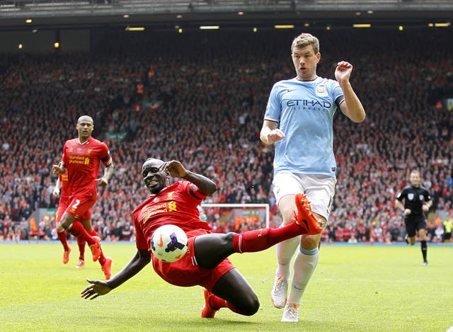 Mamadou Sakho, left, and Edin Dzeko challenge for the ball in an April 2014 encounter at Anfield