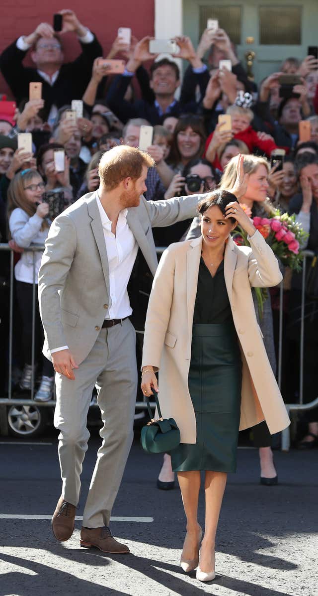 The Duke and Duchess of Sussex greet well-wishers as they arrive at Edes House, West Street, Chichester, as part of their first joint official visit to Sussex.