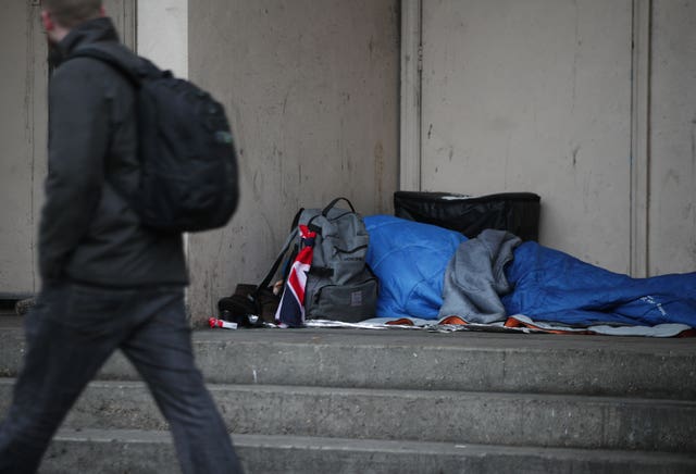 A rough sleeper in a doorway