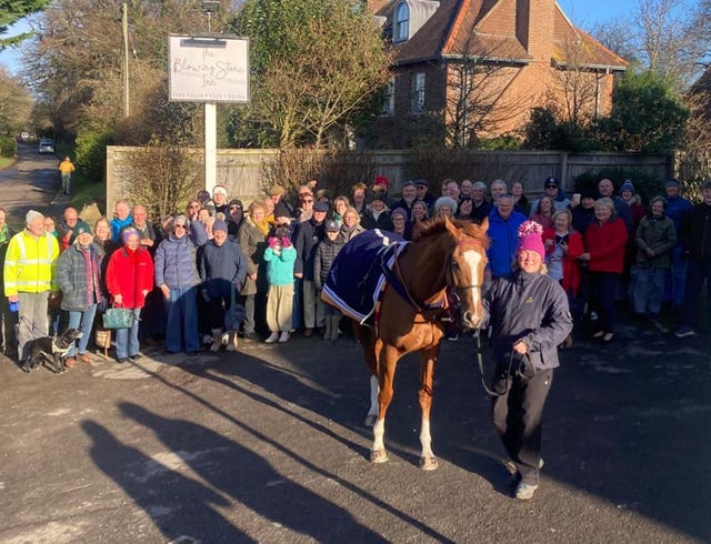Racehorse socialises with owners down the pub