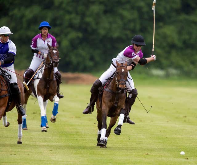 The Duke of Cambridge, right, about to take a shot (Steve Parsons/PA)