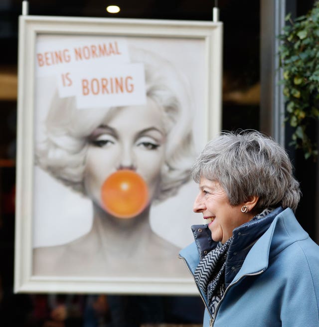 Prime Minister Theresa May leaves Smith England hairdresser salon after a visit in Salisbury, Wiltshire, with local businesses on the first anniversary of the Skripal poisoning in Salisbury (Adrian Dennis/PA).