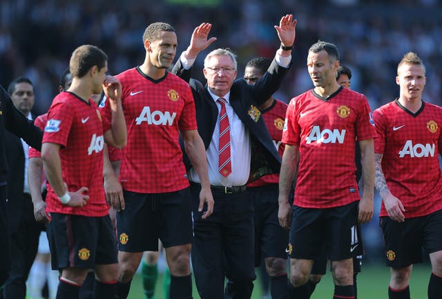 Sir Alex Ferguson, centre, salutes the fans after his final game as Manchester United manager