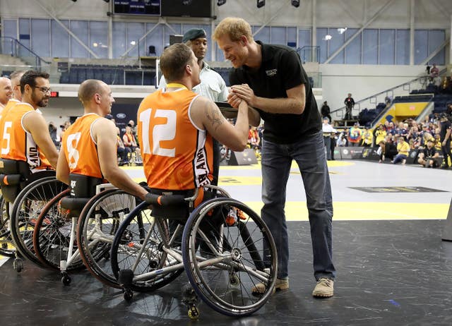 Prince Harry congratulates the competitors at the wheelchair basketball in Toronto (PA)