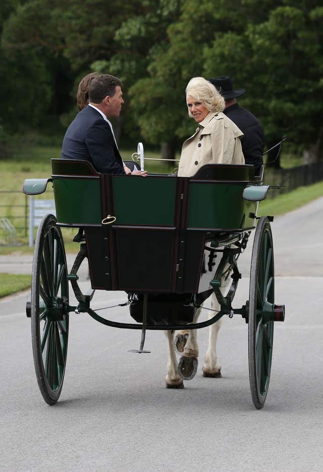 Camilla rides in a jaunting car