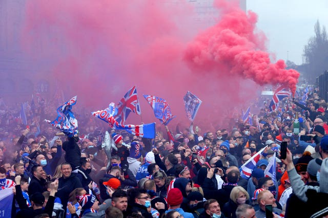 Rangers fans celebrate outside Ibrox 