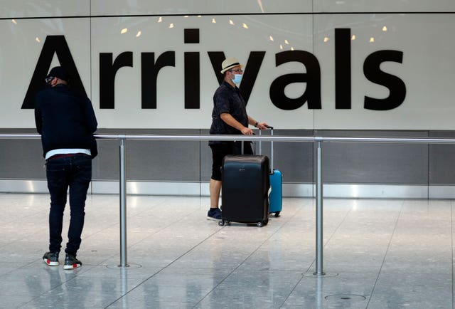 Passengers at Heathrow after people returning from Spain were told they must quarantine when they return home