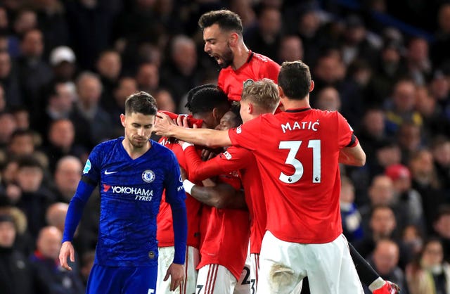Manchester United players celebrate after Anthony Martial's goal
