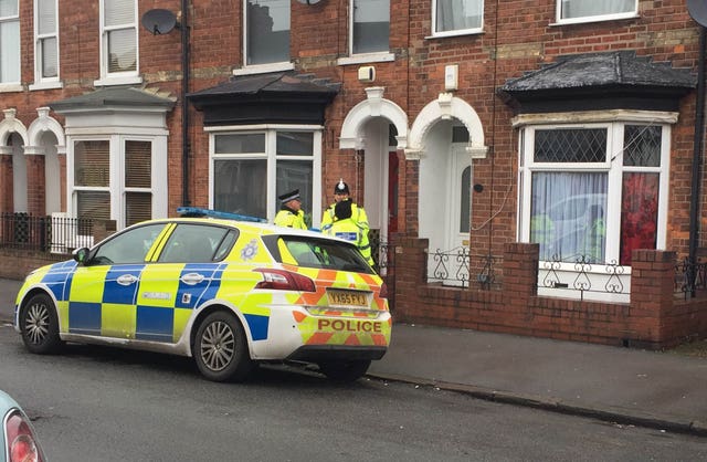 Police officers outside a house on Raglan Street in Hull
