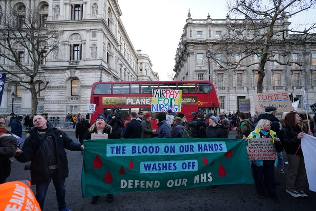 Protesters outside Downing Street, London, during the nurses' strike