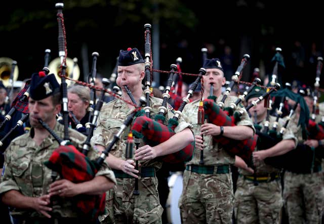 Members of the Royal Regiment of Scotland (2 SCOTS) massed pipes and drums