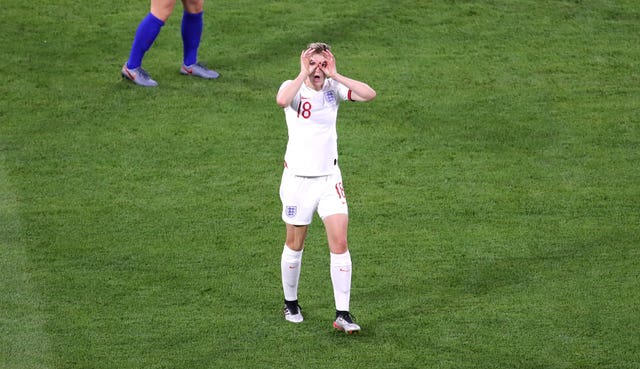 White celebrates her second goal for England