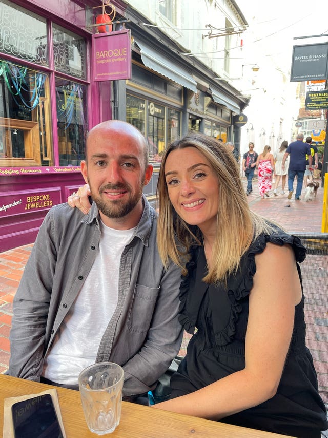 Oliver Long, left, sitting at a table next to his sister, Chole, who has her arm around him