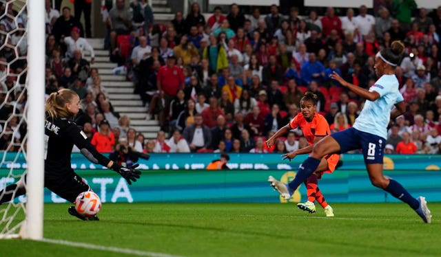 Nikita Parris, second right, scores England’s seventh goal