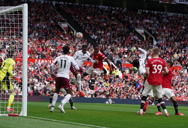 Aston Villa's Ezri Konsa, third left, heads over from a corner