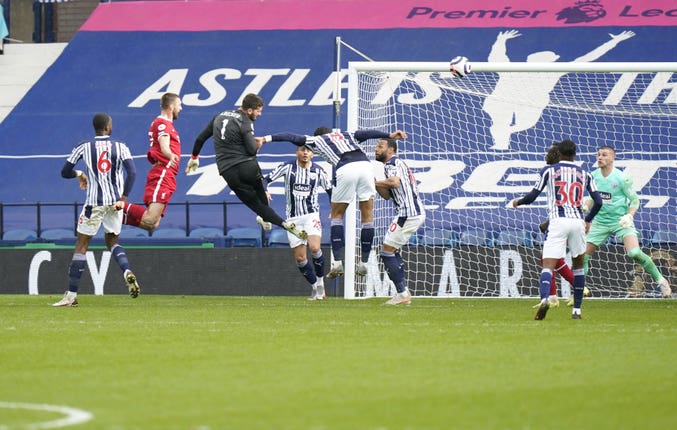 Alisson Becker scores a header