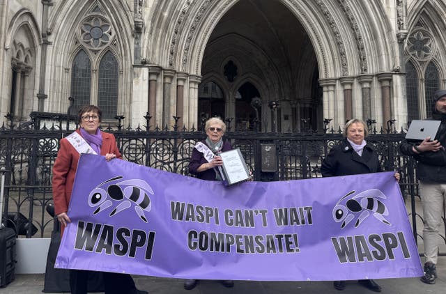 Waspi activists with a banner outside the Royal Courts of Justice in London