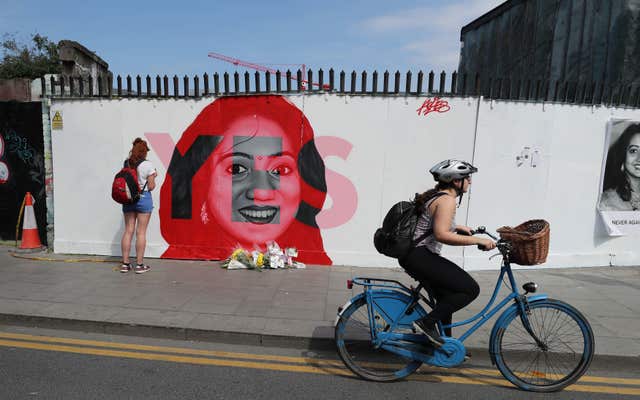 People pass a mural of Savita Halappanavar in Dublin (Niall Carson/PA)