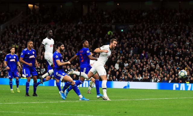 Harry Kane, right, helped Spurs secure a place in the last 16 of the Champions League