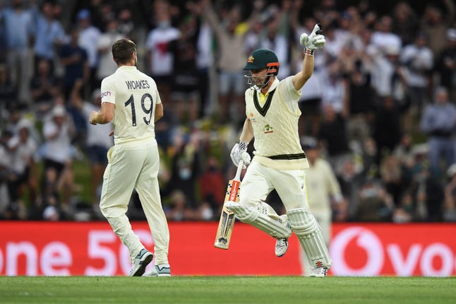 Travis Head celebrates his century