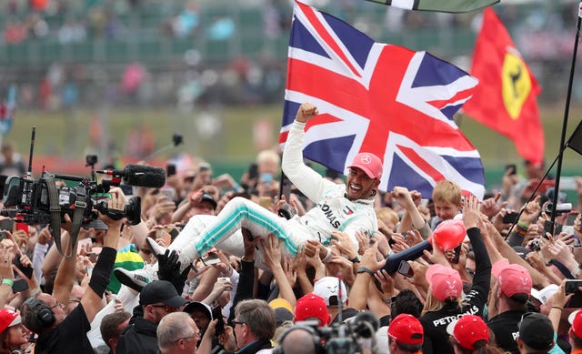 Mercedes driver Lewis Hamilton celebrates winning the British Grand Prix in 2019