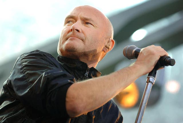 Phil Collins sings during a Genesis concert in Twickenham