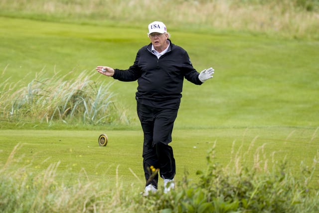 US President Donald Trump plays golf at his Trump Turnberry golf course in South Ayrshire,
