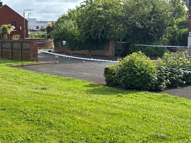 A police cordon at the scene of a stabbing outside apartments in the Kinnaird Avenue area of north Belfast