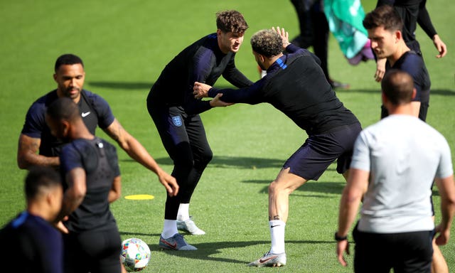 John Stones, centre left, and Kyle Walker in training with England