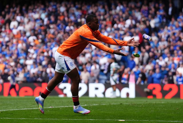 Rangers’ Neraysho Kasanwirjo clears away a glass bottle that was thrown into Sinisalo's penalty area