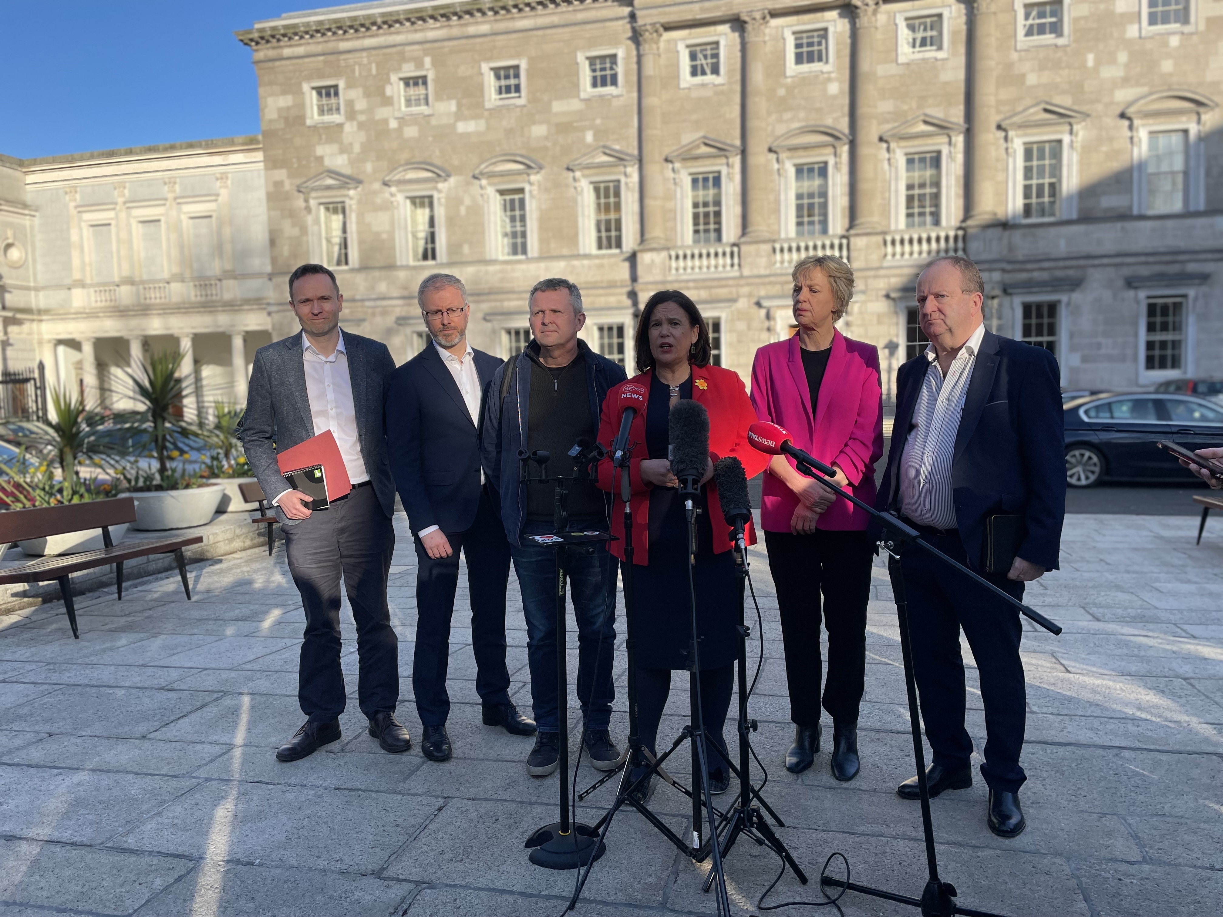 Opposition leaders stand in a row