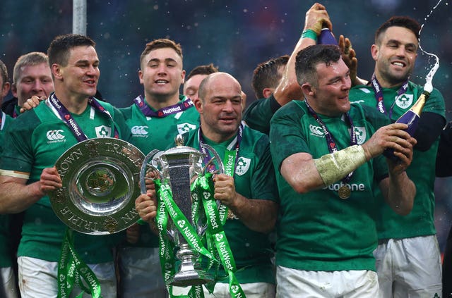 Johnny Sexton, left, lifted the Triple Crown and Grand Slam trophies at Twickenham in 2018