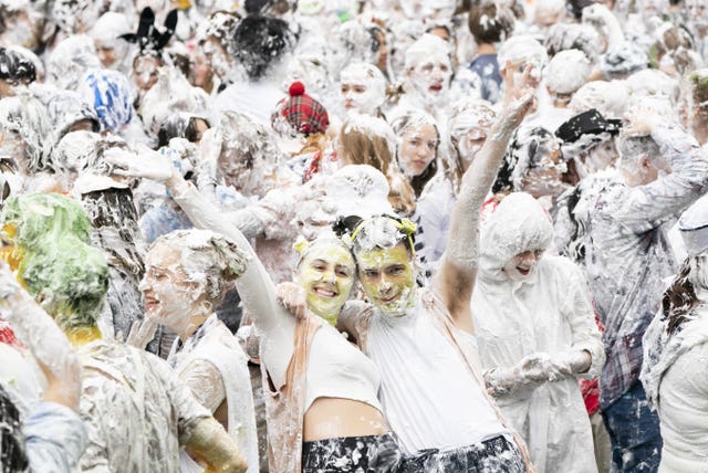 Hundreds of students take part in the traditional Raisin Monday foam fight on St Salvator’s Lower College Lawn at the University of St Andrews in Fife