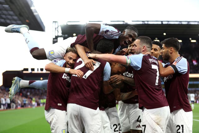 Aston Villa’s Boubacar Kamara, centre, celebrates scoring his side's second goal in their 2-0 home Premier League win against Tottenham