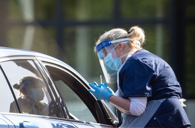 NHS staff carry out coronavirus tests at a testing facility in Bracebridge Heath, Lincoln 