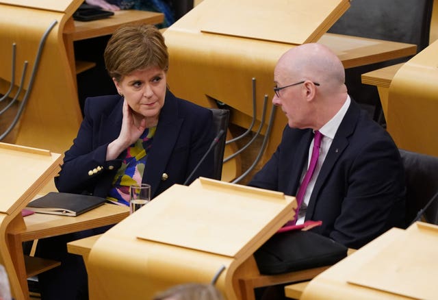 Nicola Sturgeon and John Swinney seated in Holyrood