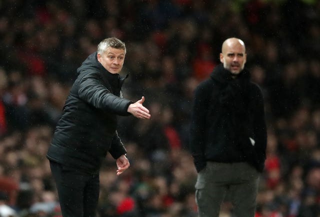 Manchester United manager Ole Gunnar Solskjaer, left, and Pep Guardiola