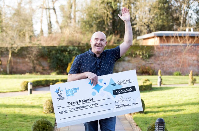 Terry Falgate celebrating his £1 million win on the UK EuroMillions Millionaire Maker at The Garden Room, Coltishall, Norfolk
