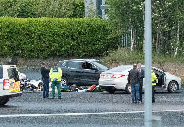 Emergency services next to a Nissan Qashqai at a business park in the Cherrywood area of Dublin  (Peter Varga/PA)