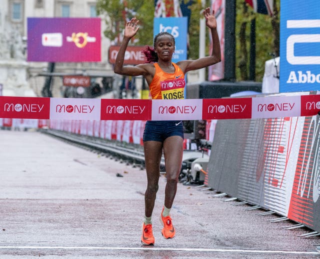 Brigid Kosgei celebrates as she crosses the line
