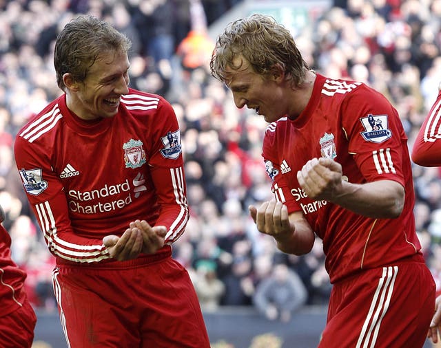 Dirk Kuyt (right) would return the favour later in the season - scoring all three as Liverpool won 3-1 at Anfield.